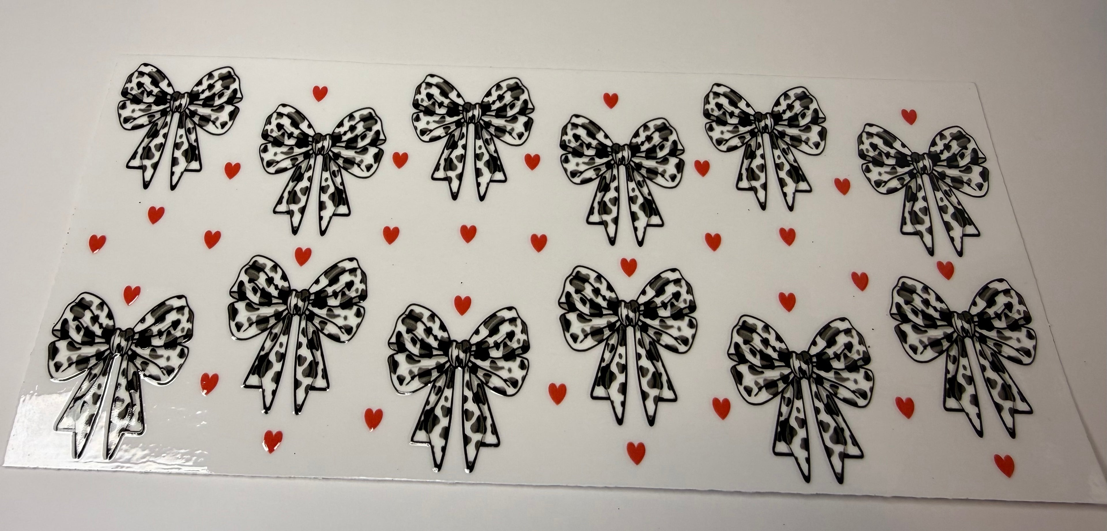 #9- BLACK AND WHITE COW PRINT BOWS